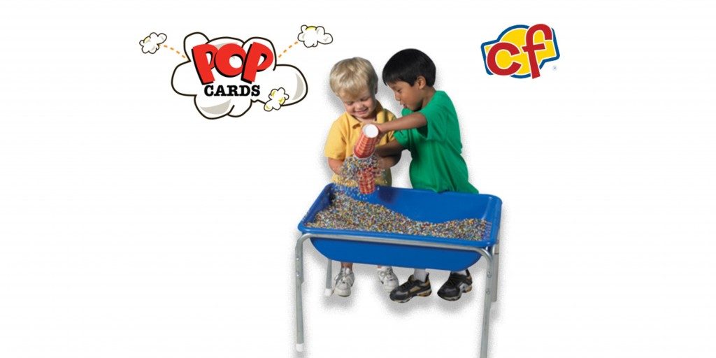 boys playing with kidfetti table