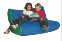children reading on large soft chair