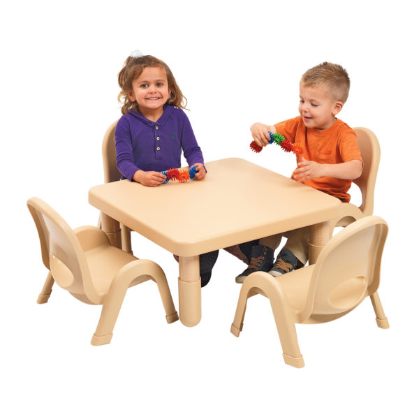 children sitting at large tan square value table