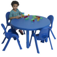 children sitting at blue round value table
