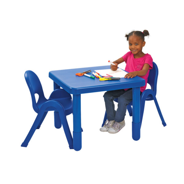 girl sitting at blue square value table