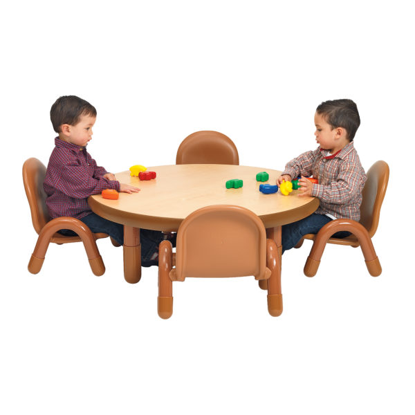 children sitting at natural wood round value table