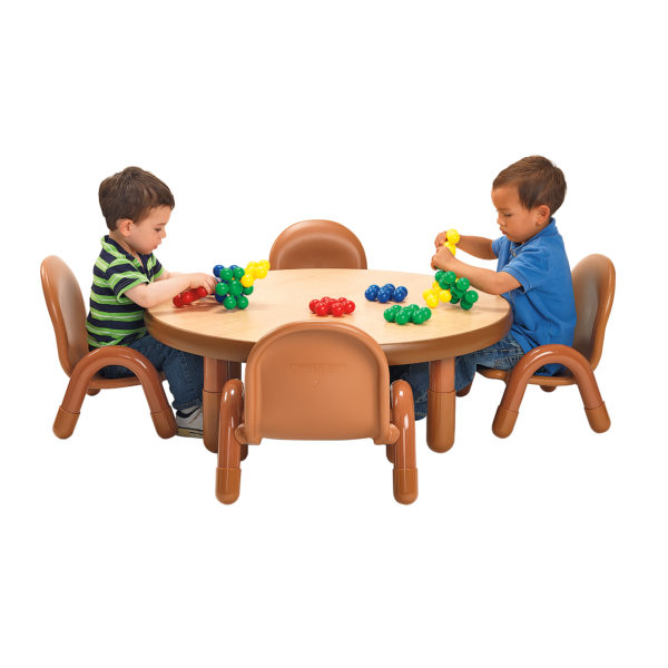 children sitting at natural wood round value table