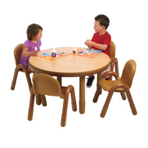 Children sitting at natural wood round value table