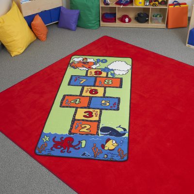 Hopscotch develops gross motor skills like balance.